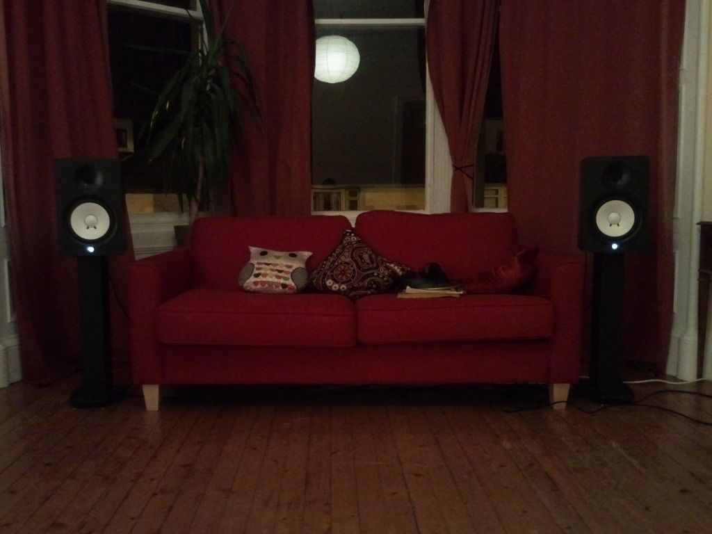 subwoofer behind couch