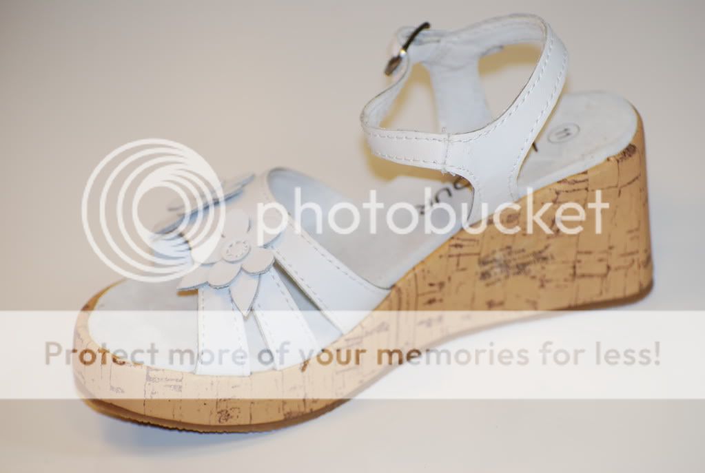 She will love these cute Wedge Sandal. Patent style strap with a 